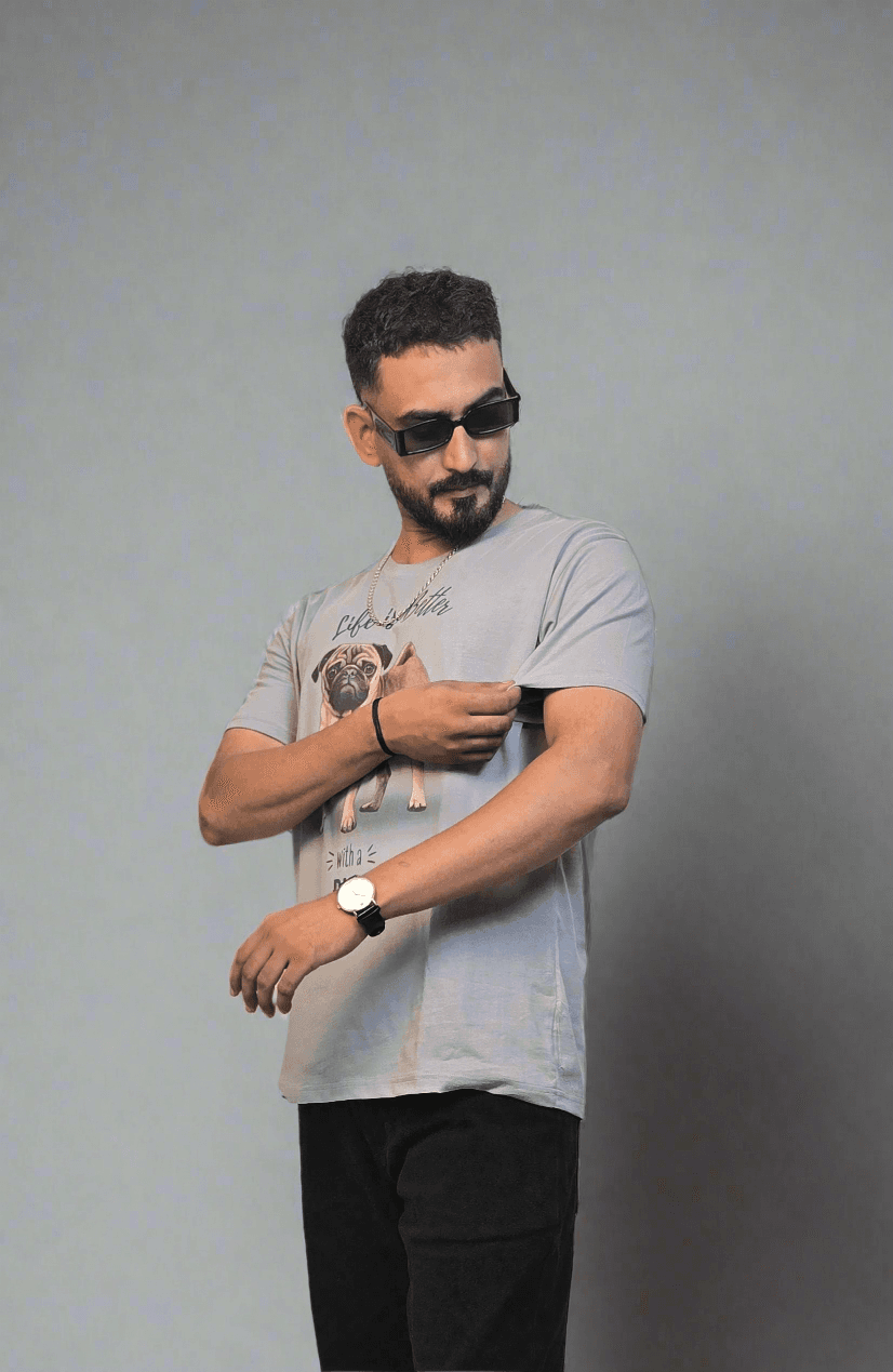 Man standing next to a plant on a white floor
