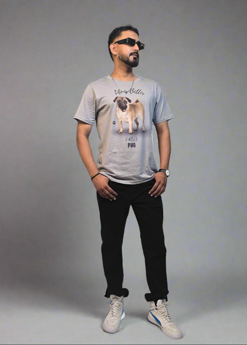 Person wearing a graphic t-shirt with a plant in the foreground on a white background