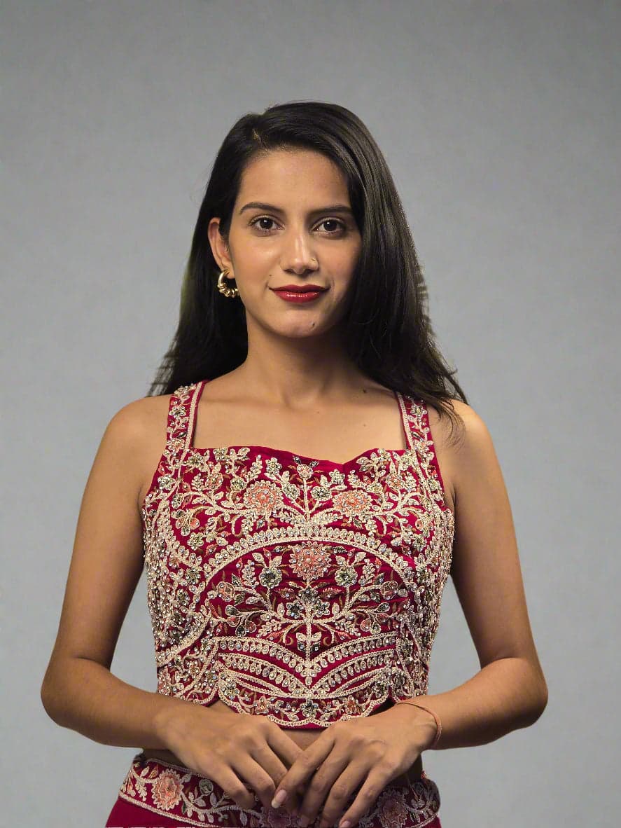 Woman wearing a patterned top with green leaves in the background